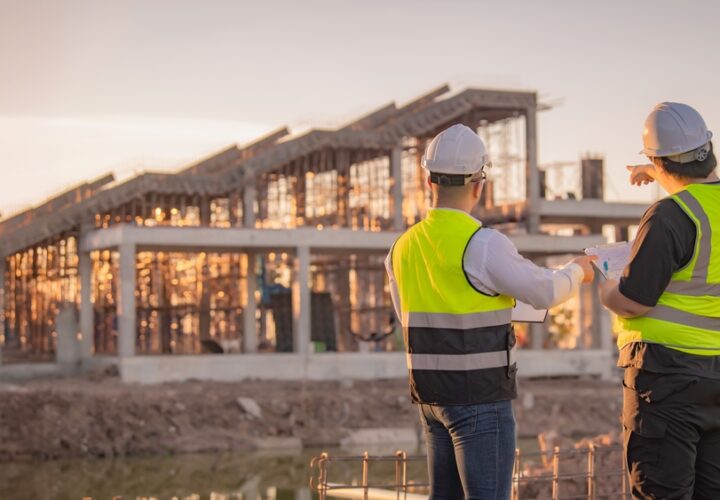 Two Construction Project Managers on building site
